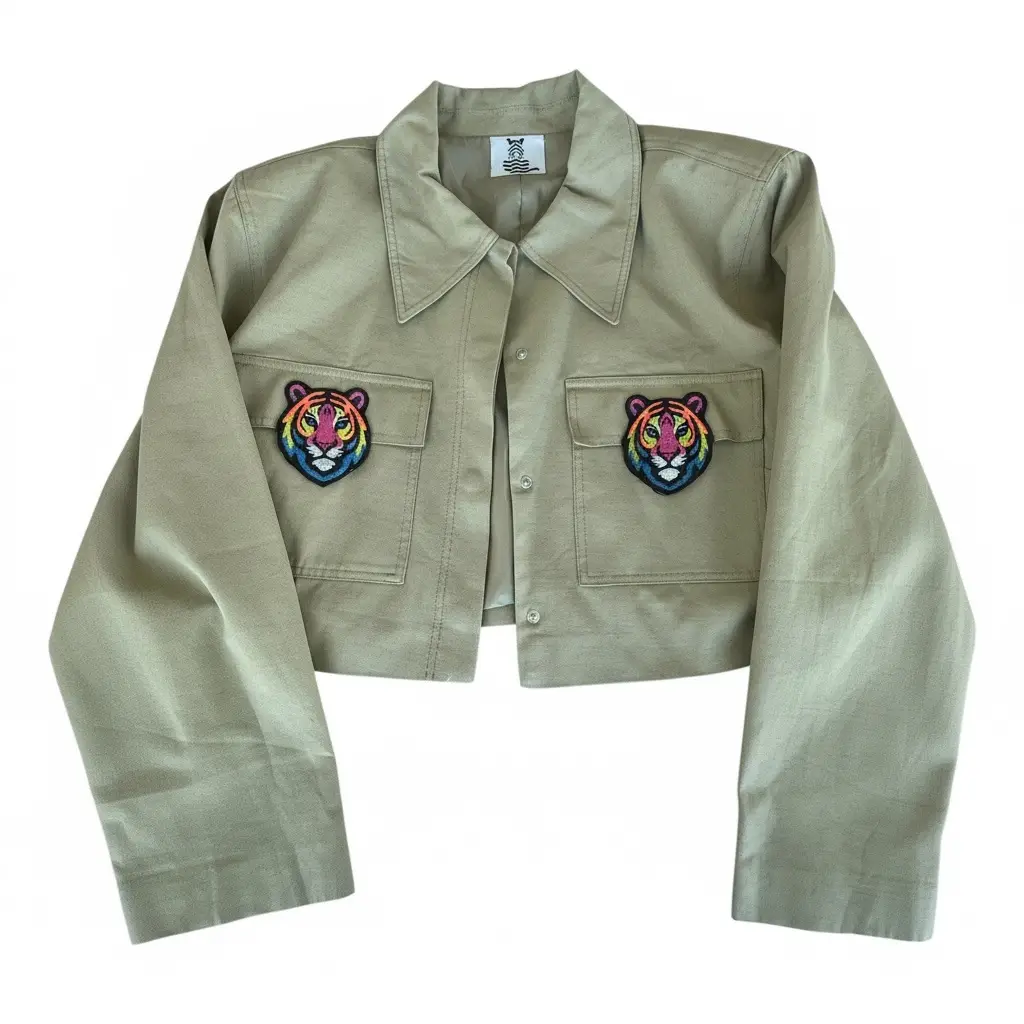 Cropped sage jacket with two rainbow embroidered tiger face patches on the chest pockets