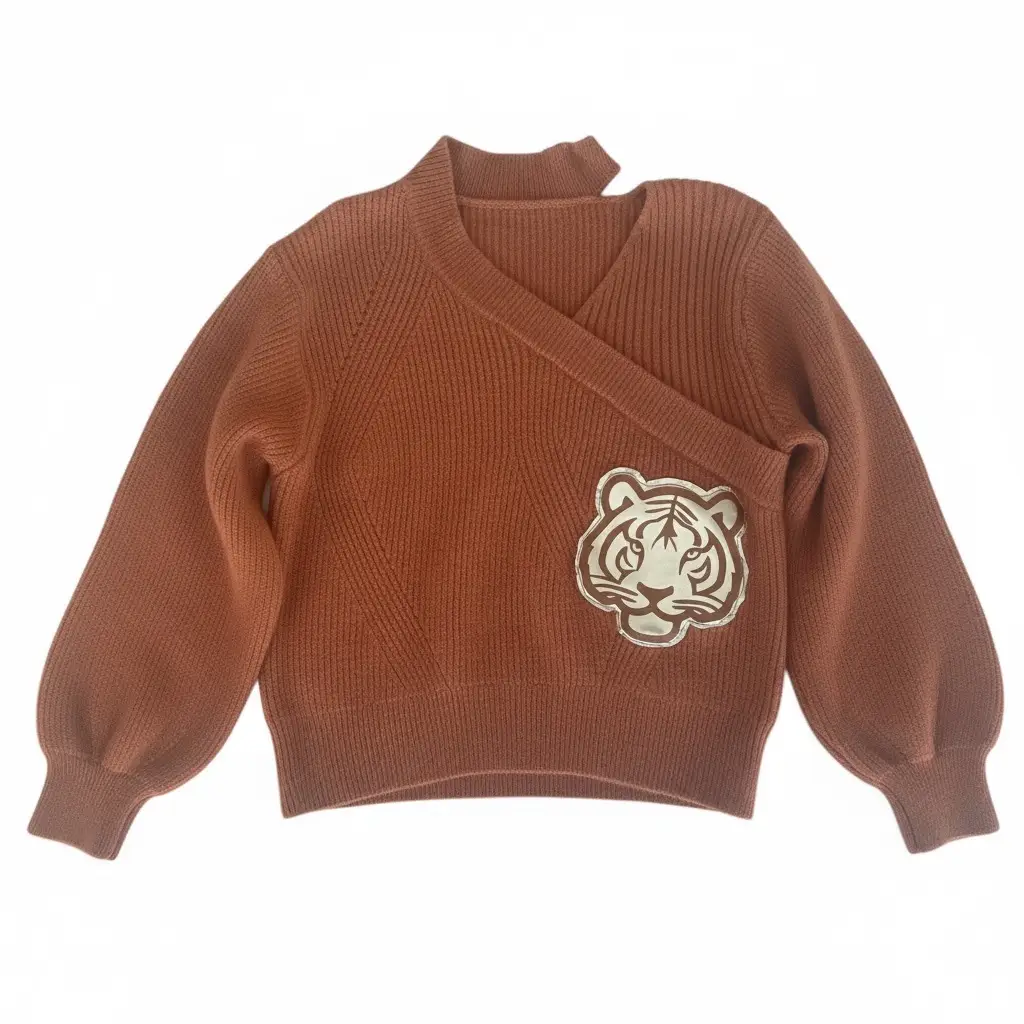 Rust wrap-front knit sweater with faux-leather tiger appliqu&eacute;