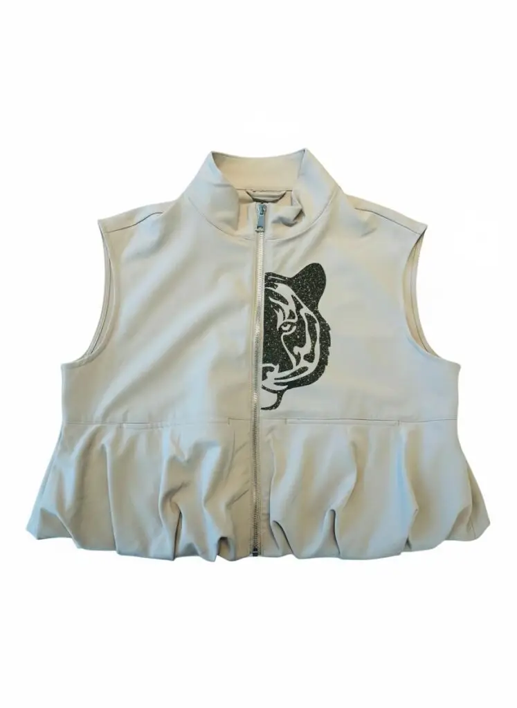 Cream sleeveless bubble-hem vest with black and gold tiger print