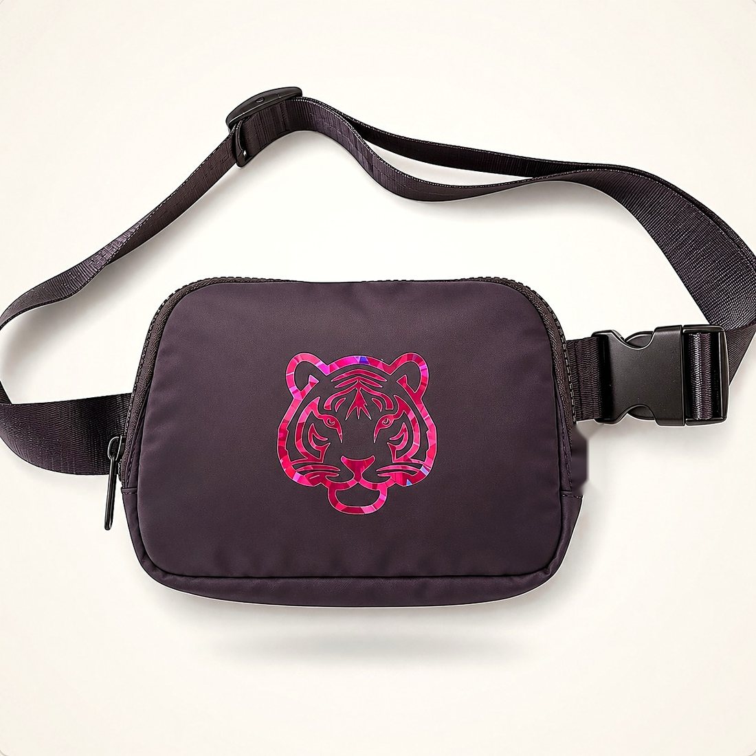 The Belt Bag in Charcoal — deep charcoal belt bag with a holographic tiger print