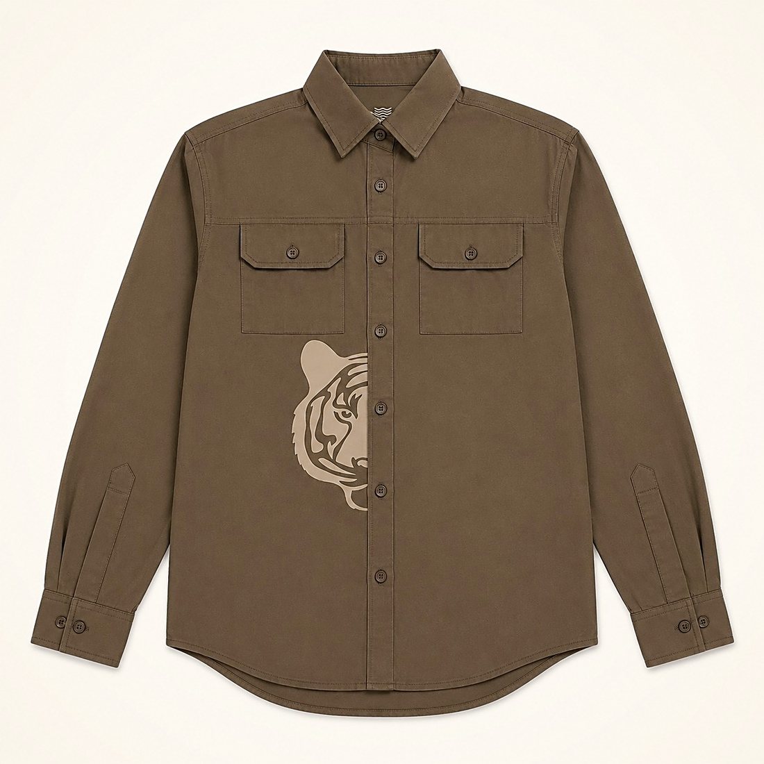 The Expedition Shirt in Canyon — olive cotton safari shirt with an off-white half tiger print at the placket