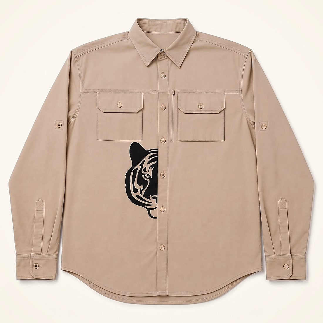 The Expedition Shirt in Dune — sand cotton safari shirt with a black half tiger print at the placket