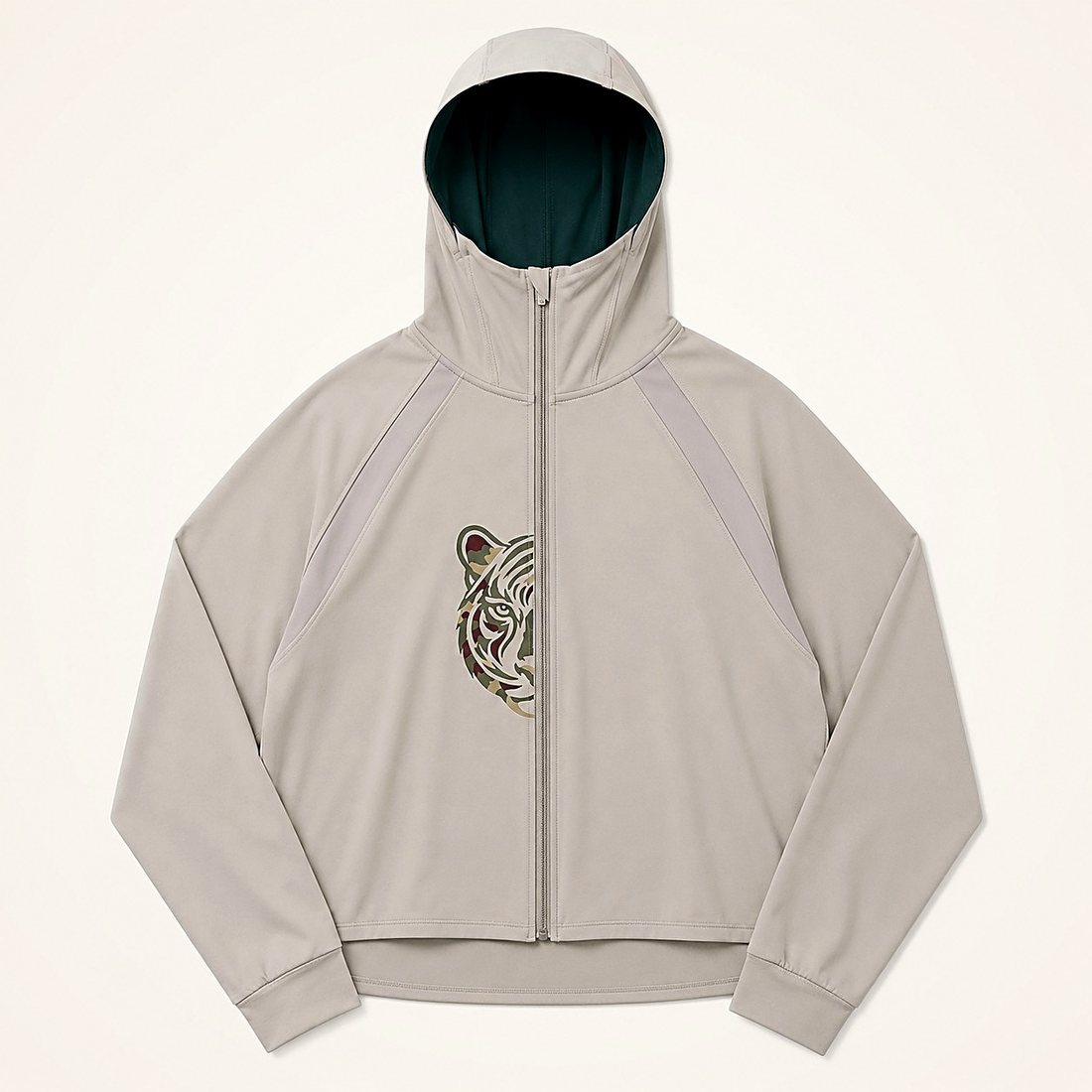 The Ladies' Zip Hoodie in Pebble — pale grey zip hoodie with a camouflage half tiger at the chest